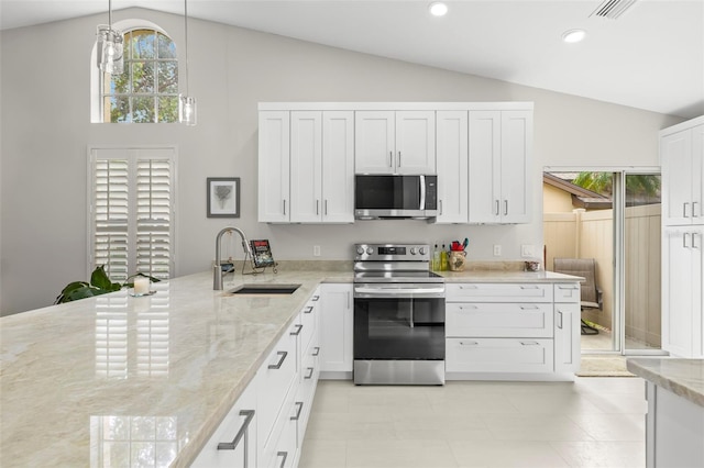 kitchen featuring sink, white cabinetry, light stone counters, pendant lighting, and stainless steel appliances