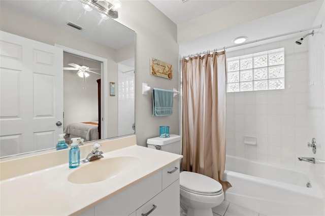 full bathroom featuring shower / bathtub combination with curtain, ceiling fan, tile patterned flooring, vanity, and toilet