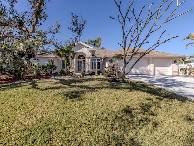 view of front of home with a garage and a front yard