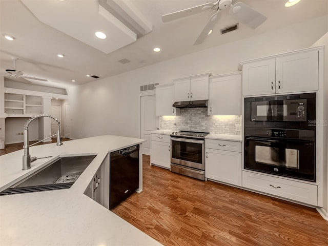 1093 Laurel Woods Dr, Nokomis, FL 34275 - kitchen featuring ceiling fan, black appliances, a sink, light countertops, and recessed lighting