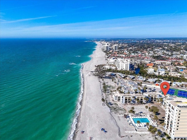 aerial view with a water view and a view of the beach