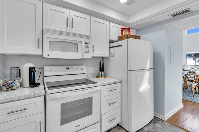 kitchen featuring white cabinetry, white appliances, decorative backsplash, and light hardwood / wood-style flooring