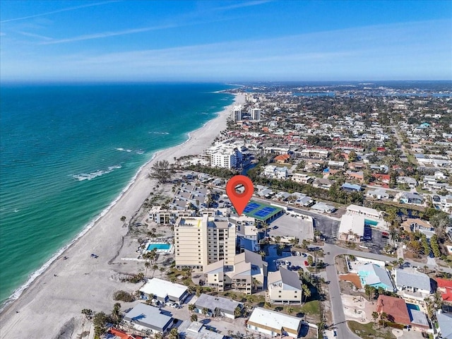 bird's eye view featuring a view of the beach and a water view