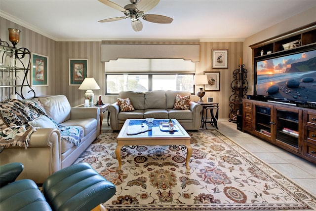 living room with light tile patterned floors, crown molding, and ceiling fan