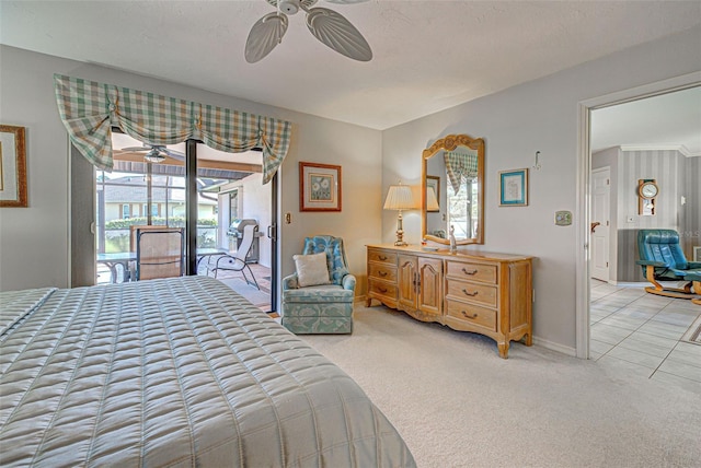 bedroom featuring light colored carpet, access to exterior, and ceiling fan