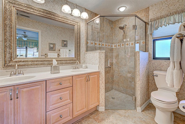 bathroom featuring vanity, toilet, a shower with shower door, and tile patterned flooring