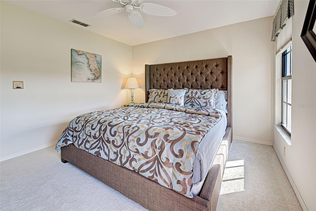 bedroom with light colored carpet and ceiling fan