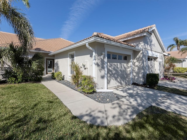 view of front of house with a garage and a front yard