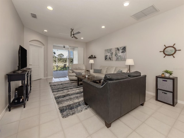 tiled living room with ceiling fan