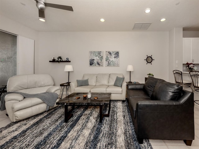 living room featuring light tile patterned flooring and ceiling fan