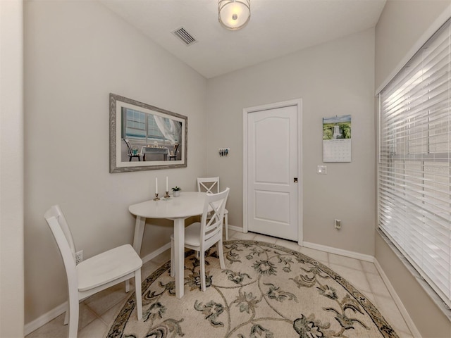 dining area featuring light tile patterned floors