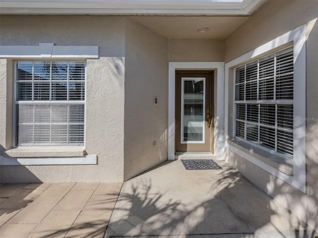 property entrance with a patio area