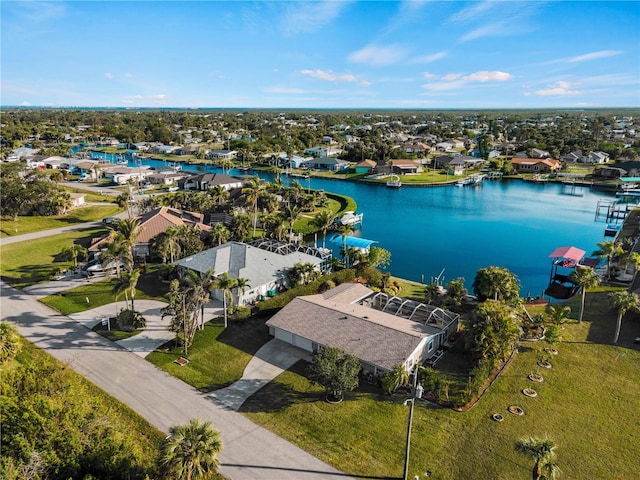 bird's eye view featuring a water view and a residential view