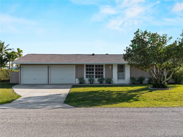 single story home featuring a garage, driveway, board and batten siding, and a front yard