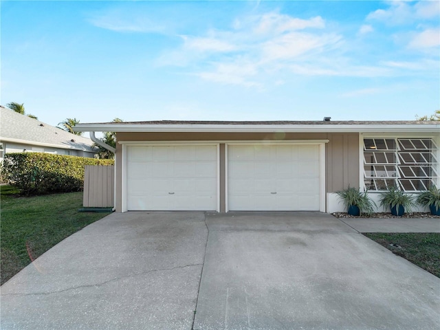 garage featuring a yard