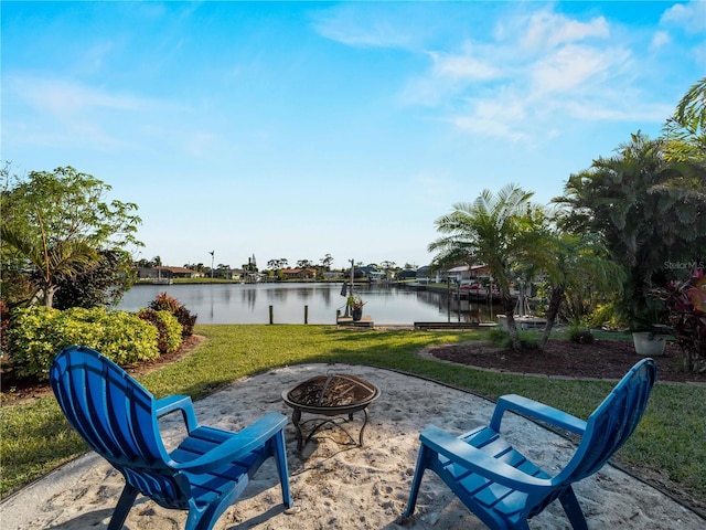 view of patio / terrace featuring a water view and an outdoor fire pit