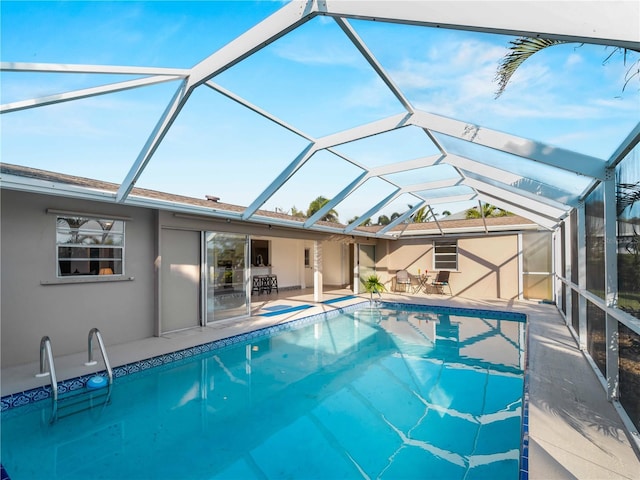 view of pool with a lanai and a patio area