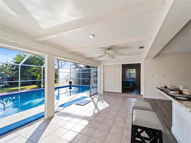 view of swimming pool featuring ceiling fan