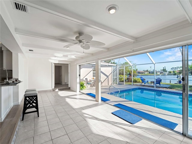 view of swimming pool with a water view and ceiling fan