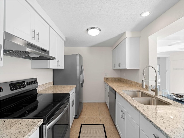 kitchen with appliances with stainless steel finishes, sink, and white cabinets