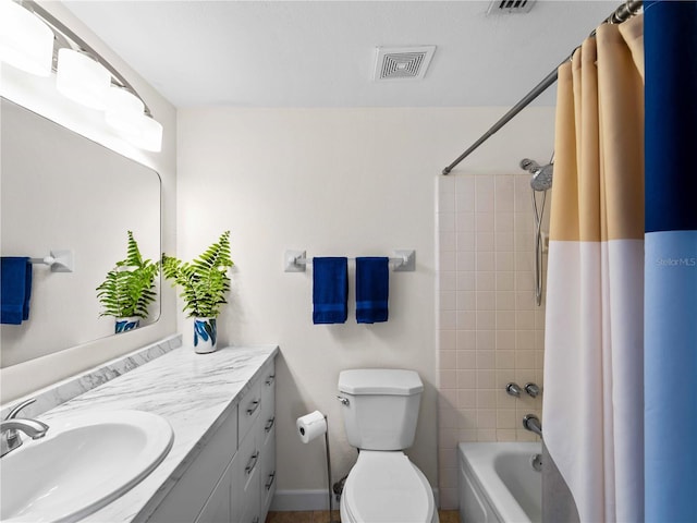 full bathroom with shower / tub combo with curtain, vanity, and toilet