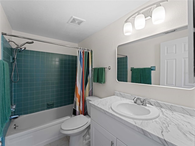 full bathroom featuring vanity, tile patterned floors, toilet, and shower / bath combo with shower curtain