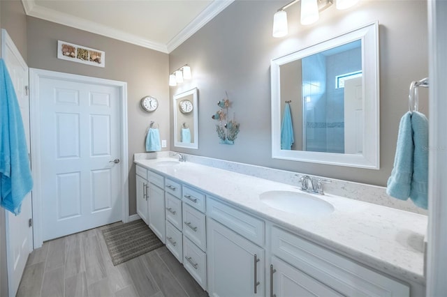 bathroom with crown molding and vanity