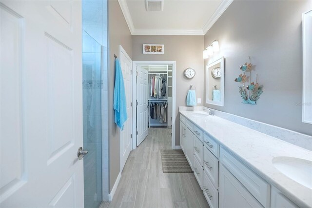 bathroom featuring vanity and crown molding