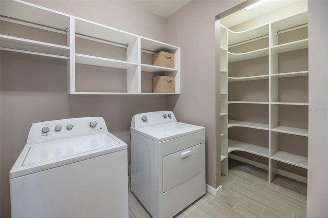 laundry area with separate washer and dryer