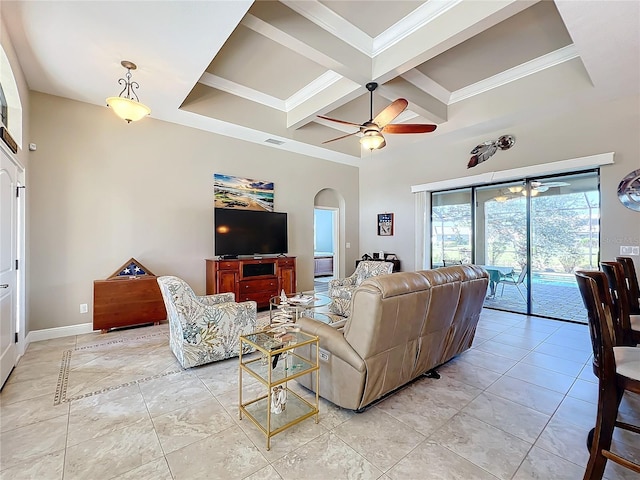 living room featuring coffered ceiling, beam ceiling, ornamental molding, and ceiling fan