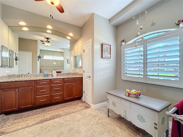 bathroom featuring vanity, ceiling fan, and walk in shower