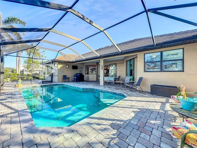 view of pool featuring a patio and a lanai