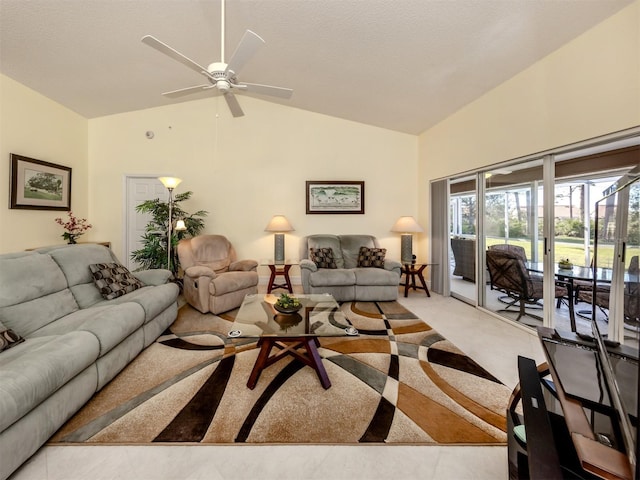 living room with high vaulted ceiling, light colored carpet, and ceiling fan