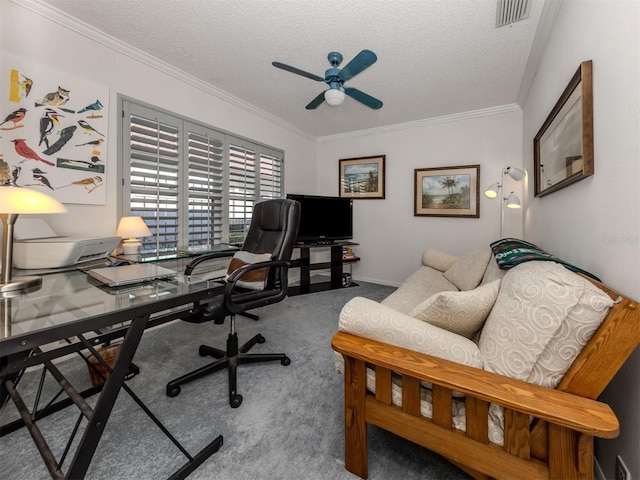 office space with crown molding, carpet, ceiling fan, and a textured ceiling