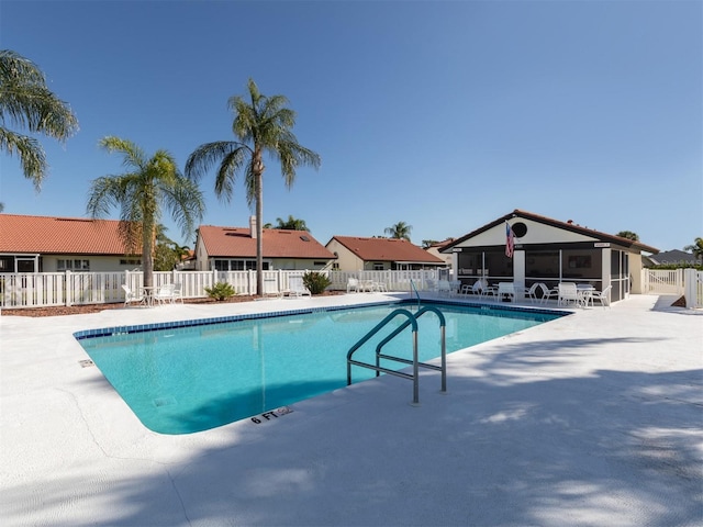 view of swimming pool with a patio area