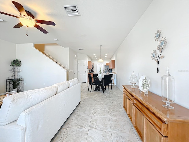 living room with ceiling fan