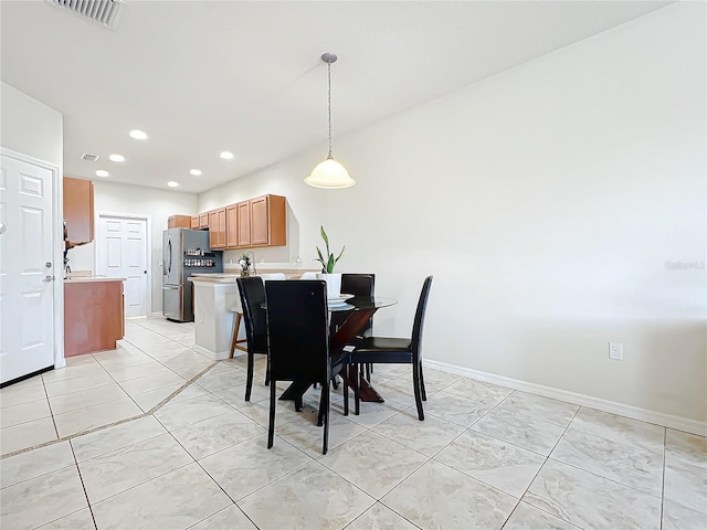 dining area featuring light tile patterned floors