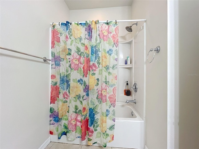 bathroom featuring tile patterned flooring and shower / tub combo with curtain