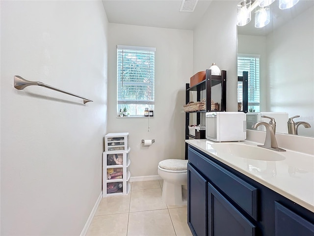 bathroom featuring tile patterned floors, toilet, and vanity