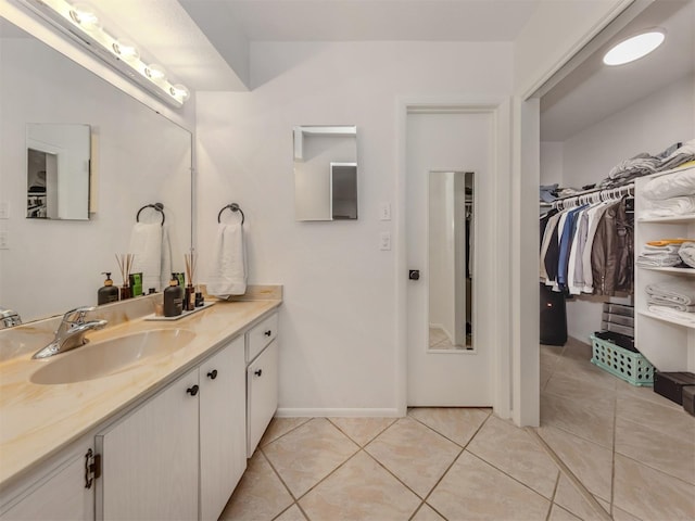 bathroom with tile patterned flooring and vanity