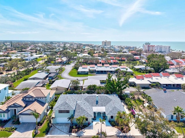 bird's eye view featuring a water view and a residential view