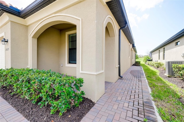 view of side of property with central AC