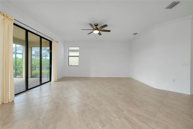 spare room with crown molding and ceiling fan