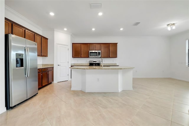 kitchen featuring light tile patterned floors, a kitchen island with sink, stainless steel appliances, light stone counters, and ornamental molding