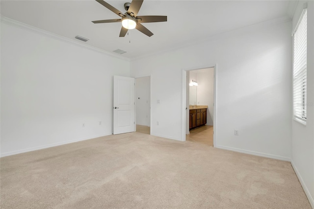 unfurnished bedroom featuring ceiling fan, ornamental molding, connected bathroom, and light carpet