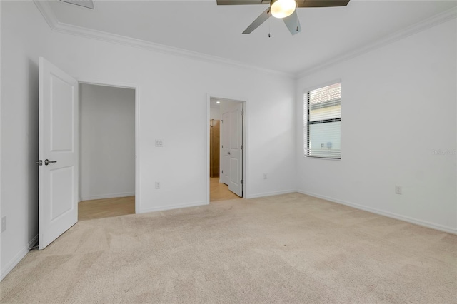 unfurnished bedroom with crown molding, light carpet, ensuite bathroom, and ceiling fan