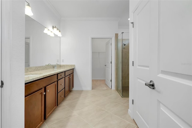 bathroom featuring an enclosed shower, vanity, tile patterned flooring, and ornamental molding