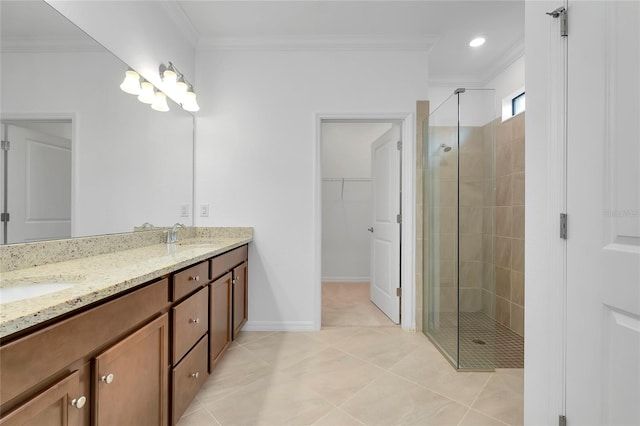 bathroom with an enclosed shower, ornamental molding, vanity, and tile patterned floors