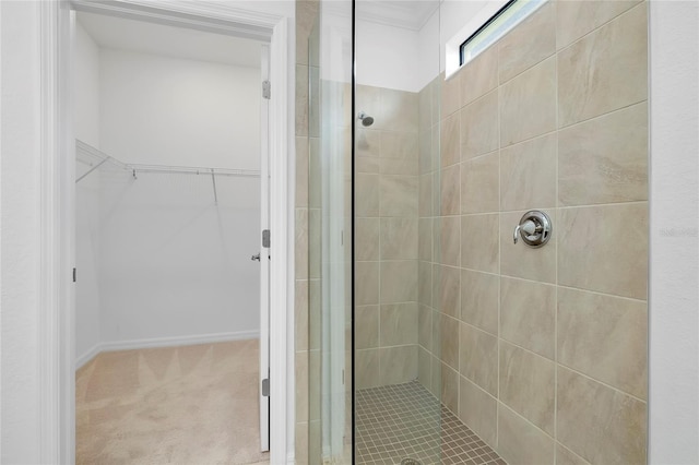 bathroom with tiled shower