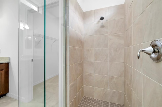 bathroom featuring vanity and a shower with shower door